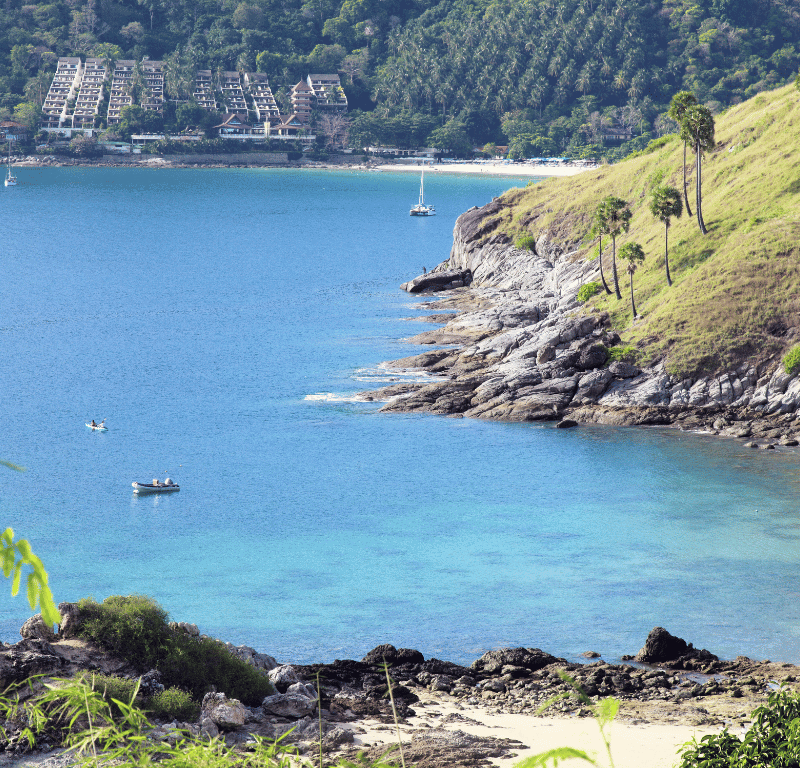 Tranquil and picturesque naiharn beach, a serene coastal paradise in phuket, thailand, known for its soft golden sands, crystal-clear waters, and serene natural beauty.