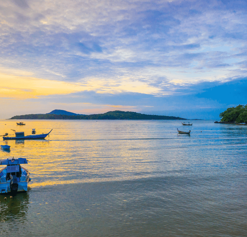 Sunrise view with a few fishing boats on mooring.